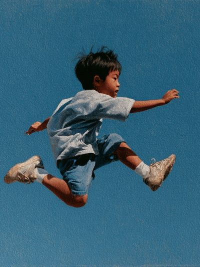 Boy Jumping Blue Sky Poster. poster