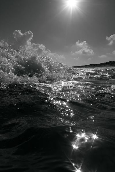 Sunlit Ocean Wave Photography Poster. poster