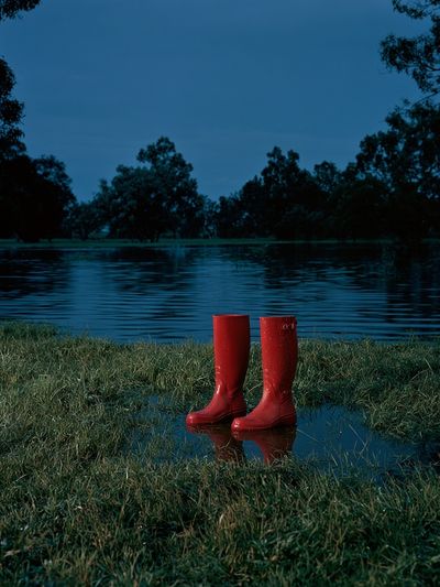 Red Rain Boots by the Lake Poster. poster
