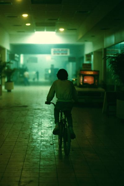 Cyclist in Neon Corridor Photography Poster.