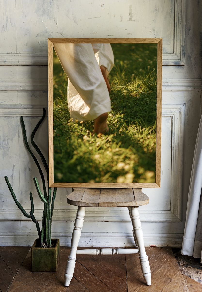 Barefoot Walk in Sunlit Grass Photography Poster. — room view 1