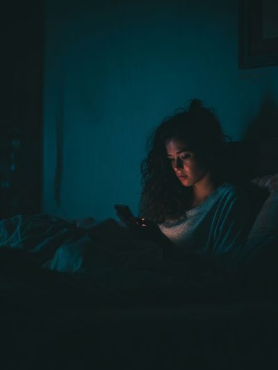 Woman Using Phone at Night — Photography Print. poster print