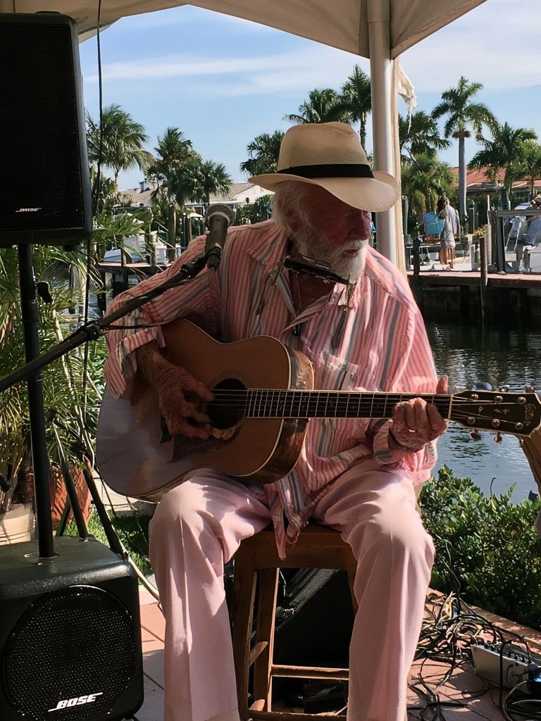 Harbor Guitarist Photography Poster. poster detail