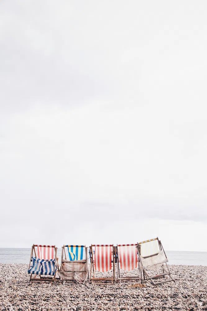 Colored striped beach chairs beach.