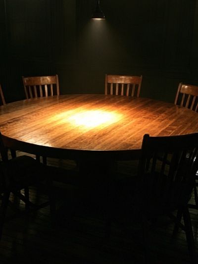 Dimly Lit Round Table Photography Poster.