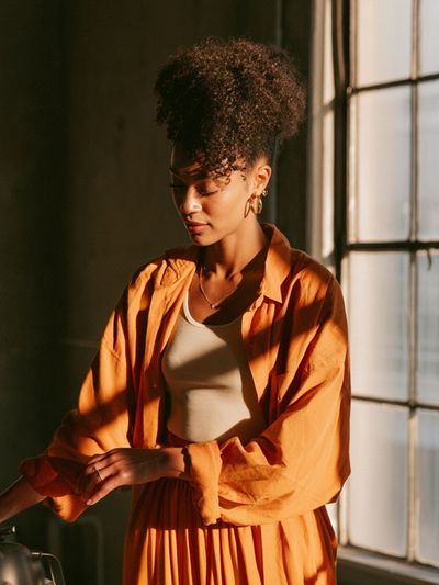 Sunlit Portrait in Orange Poster. poster