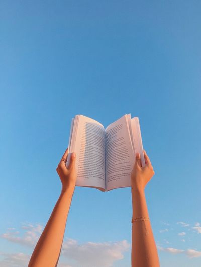 Open Book in Blue Sky Poster. poster print