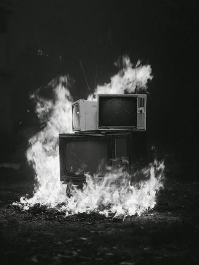 Burning TVs Black-White Poster. poster