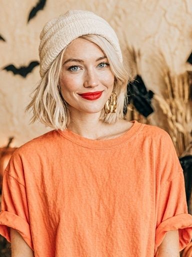 Blonde Portrait in Orange Top Poster. poster detail