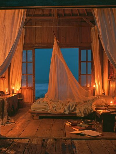 Candlelit Seaside Bedroom Print. poster