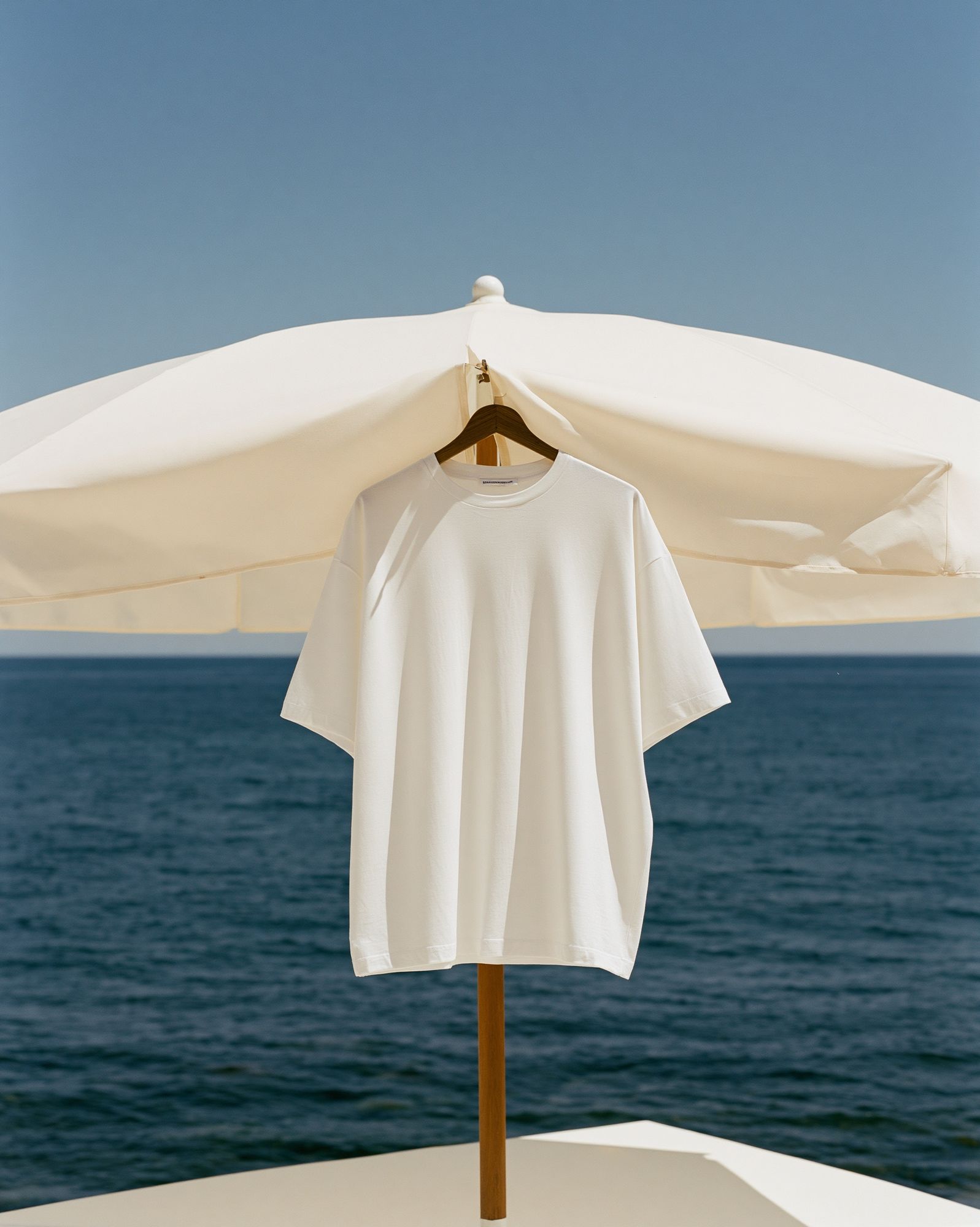 Seaside Umbrella Shirt Photography Poster. poster detail