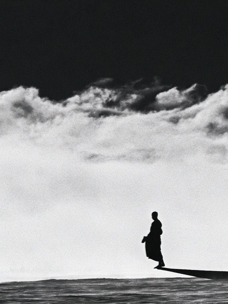 Solitary Figure in Clouds Photography Poster. poster detail