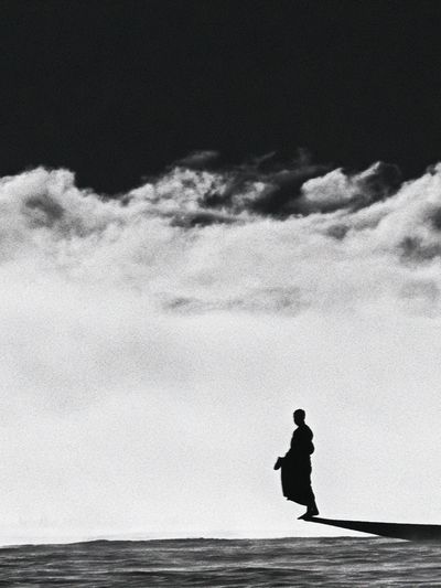 Solitary Figure in Clouds Photography Poster.