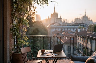 Sunlit Balcony City View Photography Poster. poster