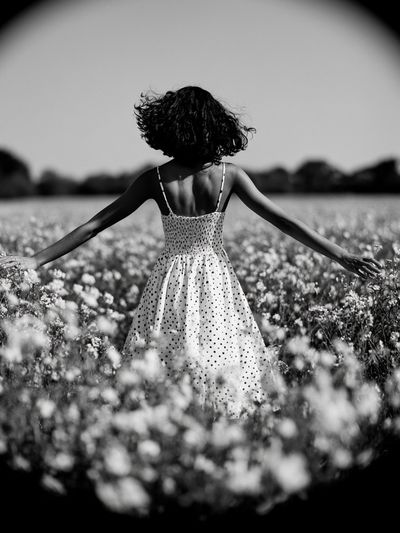 Girl in Flower Field Black-White Poster. poster