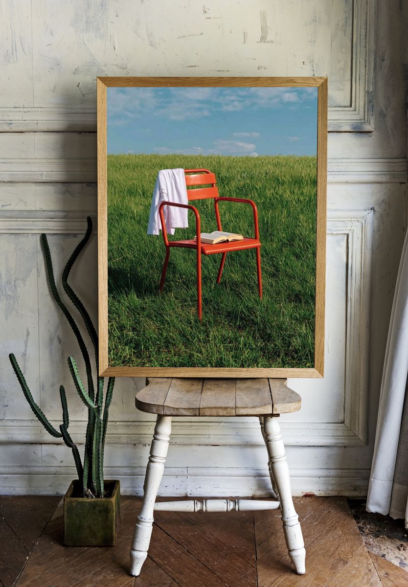 Red Chair in Meadow Photography Poster. — room view 1