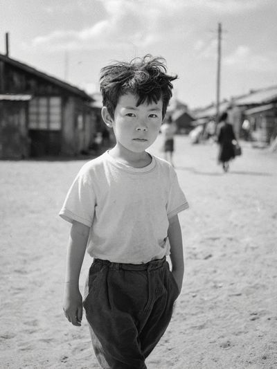 Boy in Village Street Photography Poster. poster print