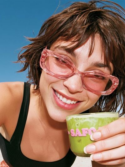 Smiling Woman with Matcha Portrait Poster. poster
