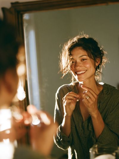 Smiling Woman in Mirror Photography Poster. poster