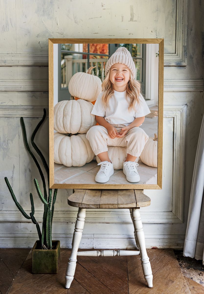 Smiling Child with Pumpkins Photography Poster. room preview