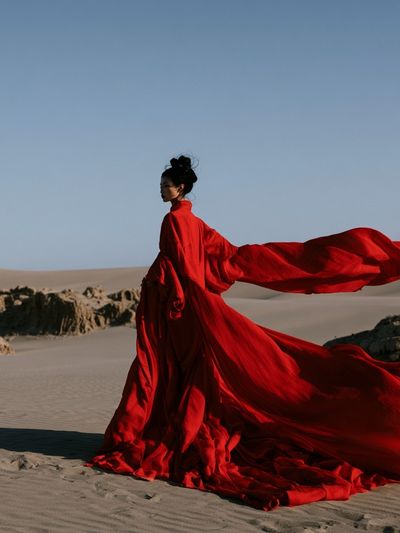 Red Gown Desert Portrait Print. poster