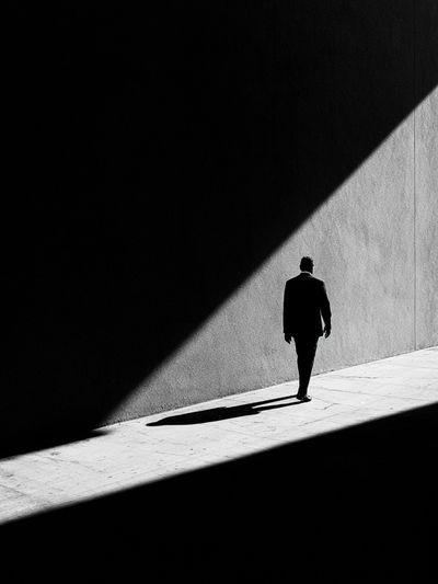 Solitary Figure in Light Poster.