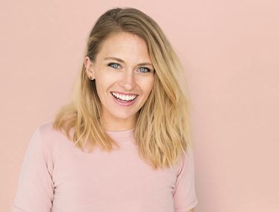Studio shot happy Caucasian woman.