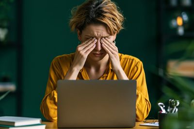 Stressed Woman at Laptop Photography Poster. poster