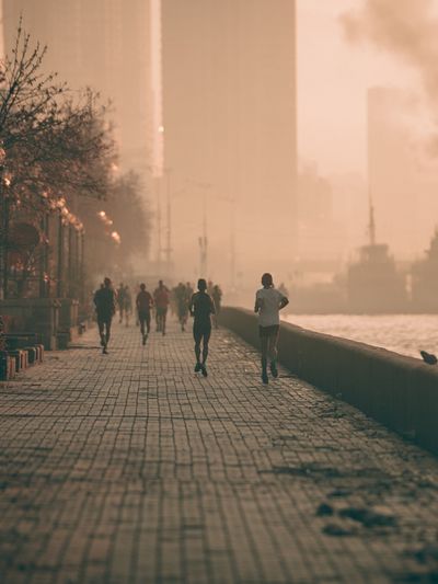 Sunset Riverside Runners Photography Poster.