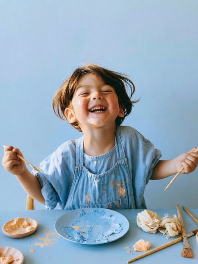 Joyful Child Painting Portrait Poster. poster