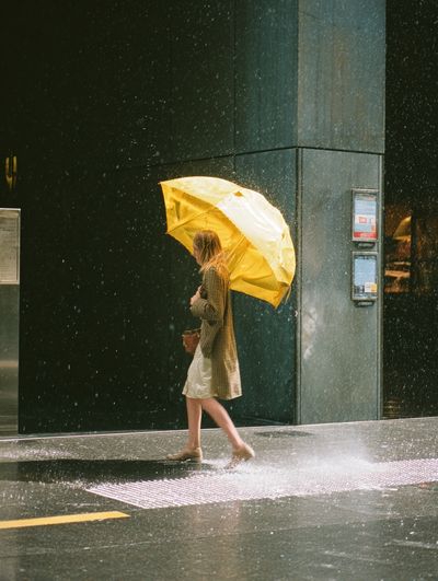 Woman with Yellow Umbrella — Photography Print. poster