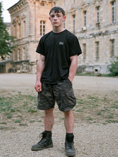 Young Man at Chateau — Photography Print. poster