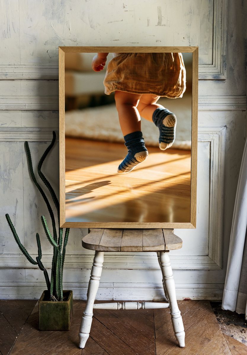 Toddler Jumping in Sunlight Photography Poster. — room view 1