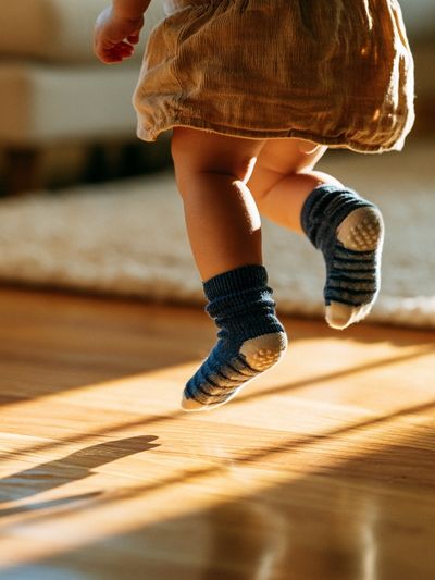 Toddler Jumping in Sunlight Photography Poster. poster