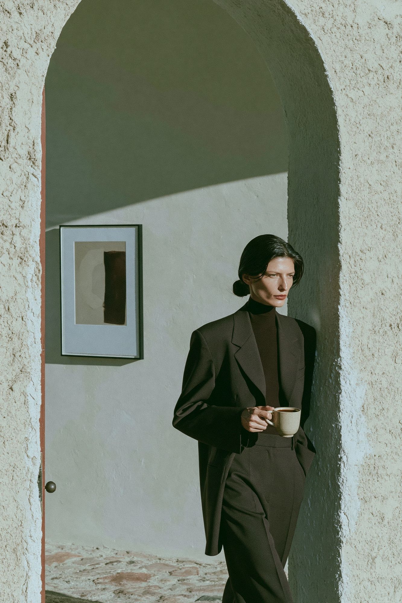 Elegant Woman in Archway Photography Poster. poster detail