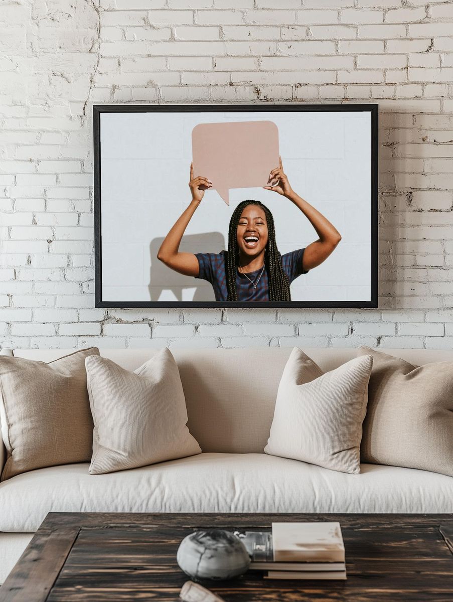 Cheerful black woman showing blank. — room view 1