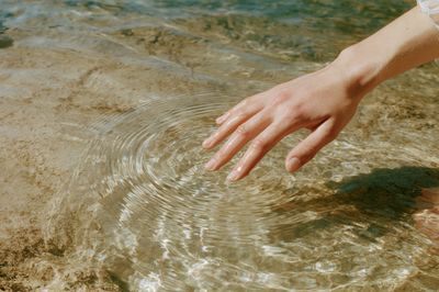 Hand in Sunlit Water Photography Poster. poster
