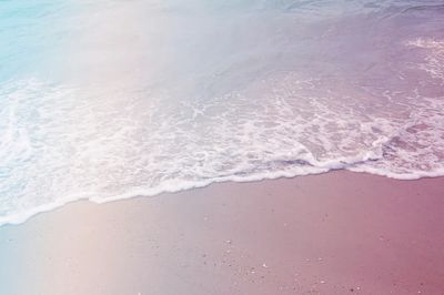 Drone view ocean wave washing. poster print
