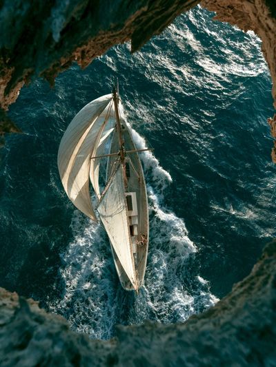 Sailing Boat Over Turquoise Sea Poster.