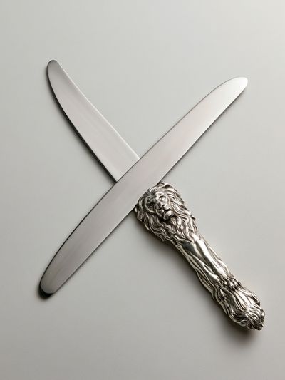 Silver Lion Letter Opener Poster. poster