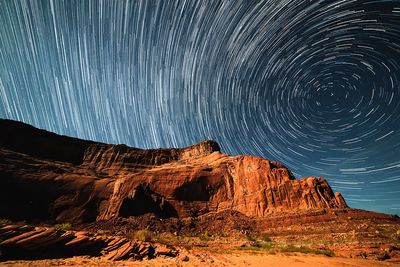 Star Trails Over Monument Valley — Photography Print. poster