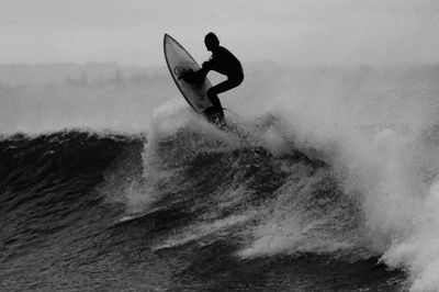 black white photo surfer catching. poster print