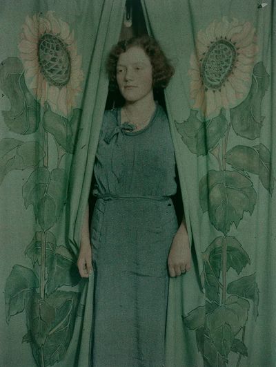 Woman sunflower print curtains (1900-1930). poster print