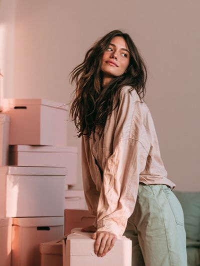 Woman Among Boxes Photography Poster. poster