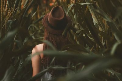 girl wearing brown hat walking. poster print