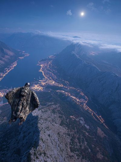 Wingsuit Over Moonlit Mountains Poster.