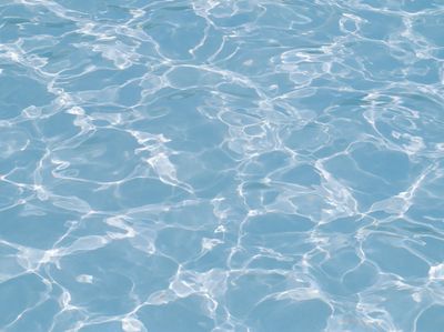Sunlit Water Ripples Photography Poster. poster